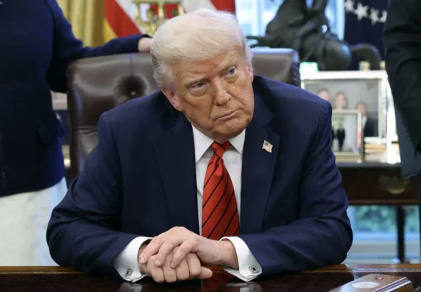 AFP__20250418__2210784282__v3__Preview__PresidentTrumpSignsExecutiveOrdersInTheOvalO